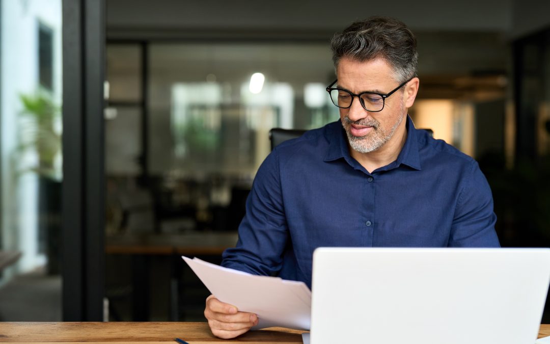 Confident man managing members with an online member directory